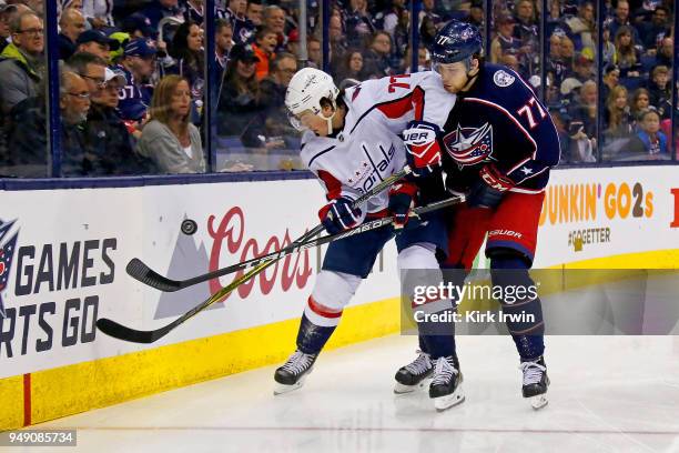 Oshie of the Washington Capitals and Josh Anderson of the Columbus Blue Jackets battle for control of the puck in Game Three of the Eastern...