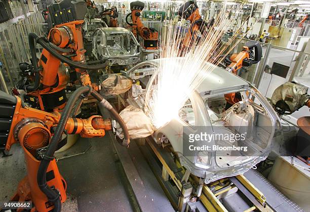 Robots welders work on a Skoda Fabia car body at the Skoda plant in Mlada Boleslav, Czech Republic, Friday, June 18, 2004.