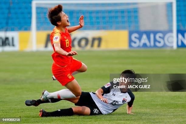 Thailand's midfielder Nipawan Panyosuk vies for the ball with China's defender Jun Ma during the AFC Women's Asian Cup match for third place between...
