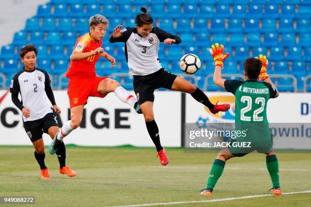 China's forward Ying Li vies for the ball with Thailand's defender Natthakarn Chinwong during the AFC Women's Asian Cup match for third place between...