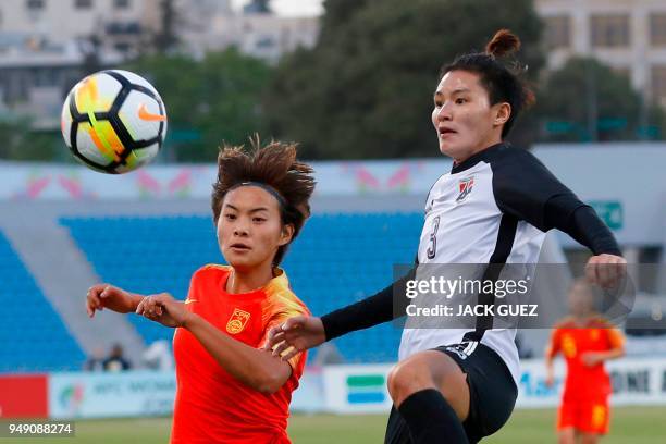 Thailand's defender Natthakarn Chinwong vies for the ball with China's midfielder Shuang Wang during the AFC Women's Asian Cup match for third place...