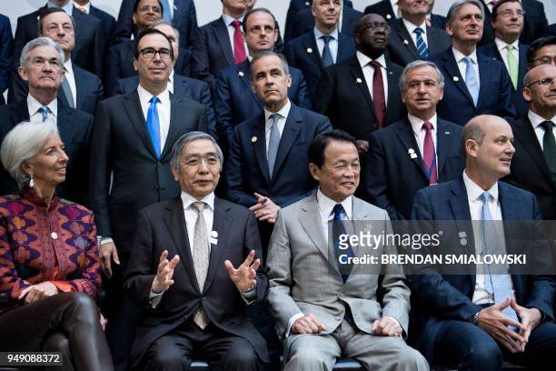 International Monetary Fund Managing Director Christine Lagarde, Japan's Central Bank Governor Haruhiko Kuroda, Japan's Finance Minister Taro Aso,...