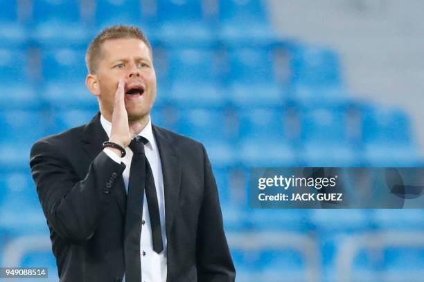 China's head coach Sigurdur Eyjolfsson instructs his players during the AFC Women's Asian Cup match for third place between China and Thailand at the...