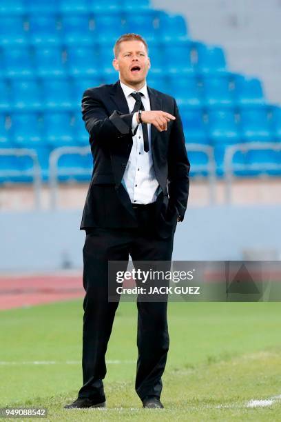 China's head coach Sigurdur Eyjolfsson instructs his players during the AFC Women's Asian Cup match for third place between China and Thailand at the...