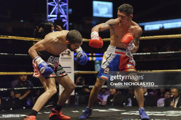Filipino boxer Michael Dasmarinas fights French opponent Karim Guerfi during the International Boxing Organisation Batamweight world title in...