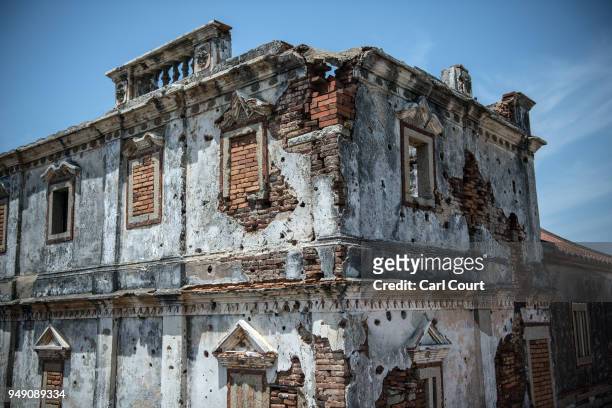 An old Western style house still bears bullet holes and damage from the Battle of Guningtou, an attempted invasion of Kinmen by Communist forces in...