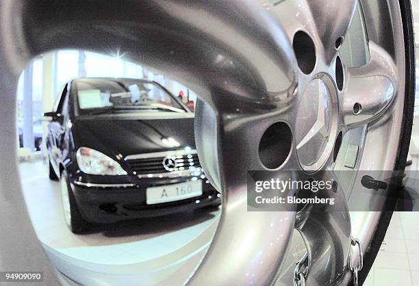 Mercedes-Benz A 160 seen through a wheel rim at a dealership in Frankfurt, Germany, Monday, February 2, 2004.DaimlerChrysler AG's fourth-quarter net...