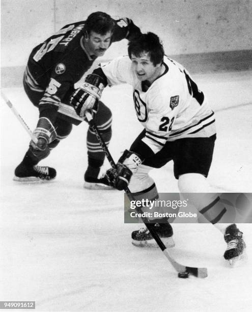 Buffalo Sabres Yvon Lambert, left, pursues Boston Bruins Brad Park, right, during a game at the Boston Garden, April 8, 1982.