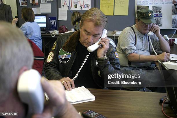 Wade Sanders, center, and other veterans man the phones in the Iowa headquarters of presidential candidate John Kerry in Des Moines, January 16,...