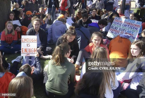 Students stage a sit-down in Lafayette Square across the White House in Washington, DC on April 20, 2018 to protest gun violence. - Students across...