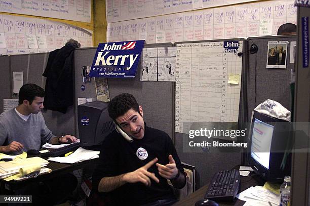 Ari Melber, right, a field organizer for the Kerry for President campaign explains the importance of attending the caucus and voting for Kerry to a...