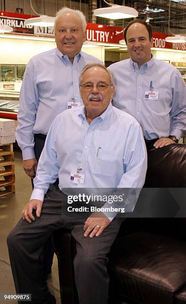 Costco Wholesale Corp. President and CEO James Sinegal, seated, is flanked by Senior Executive Vice President Richard DiCerchio, left, and Chief...