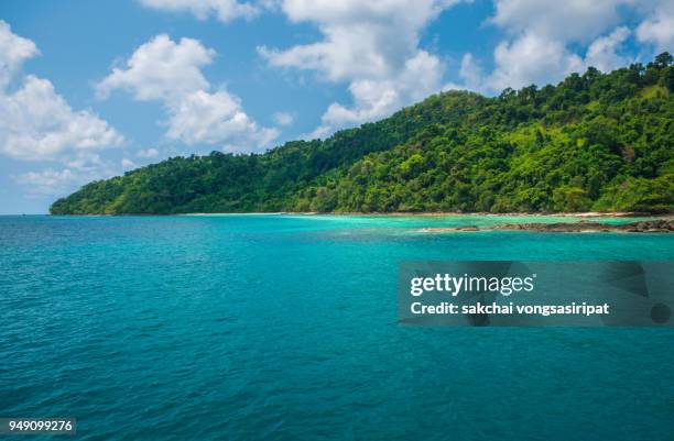 scenic view of island against sky - east timor stock pictures, royalty-free photos & images