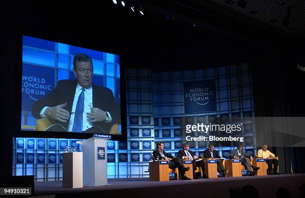John Ashcroft, United States Attorney General is seen on a screen during a panel discussion at the World Economic Forum in Davos, Switzerland,...