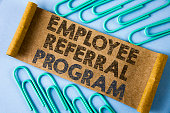 Text sign showing Employee Referral Program. Conceptual photo strategy work encourage employers through prizes written on Folded Cardboard paper piece on plain blue background within Paper Pins.