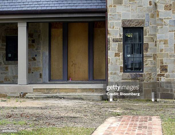 The home of former Enron executives Lea and Andrew which they had built, but never moved into, is seen boarded up at 3005 Del Monte Drive in the...