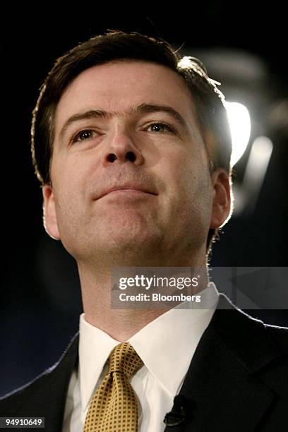 Deputy Attorney General James Comey listens during a press conference on the Enron Corp. Case at the Department of Justice in Washington, DC,...