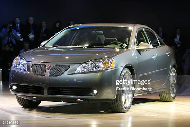 Pontiac's G6 is unveiled during the North American International Auto Show at Cobo Arena in Detroit, Michigan, Monday, January 5, 2004.