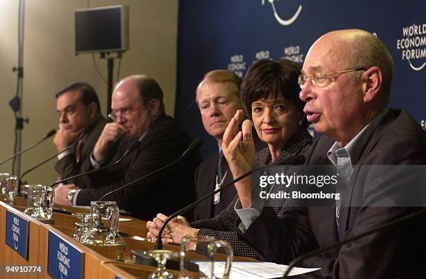 The co-chairs of the World Economic Forum Annual Meeting 2004 are seen during the opening press conference in Davos, Switzerland, January 21, 2004....