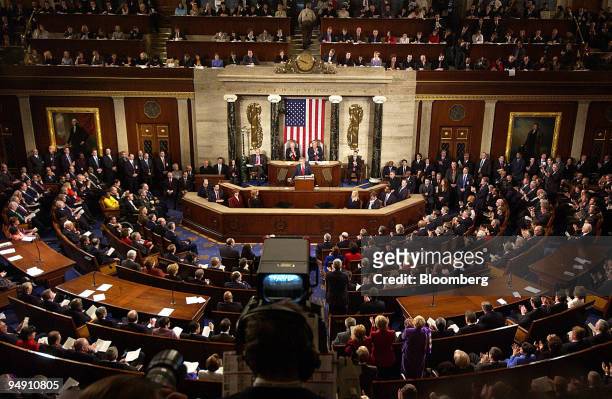 President George W. Bush, center, delivers the State of the Union speech to Congress in Washington, DC, Tuesday, January 20, 2004. President Bush...