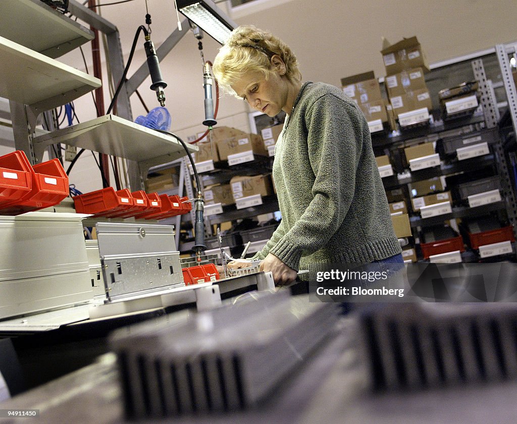 Lara Latino checks heat sinks at the Danfoss Drives manufact