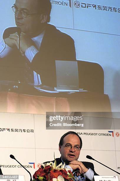 Peugeot Citroen President Jean Martin Folz speaks during the joint venture press conference with Dongfeng Motor Corp. President Miao Wei in Beijing,...