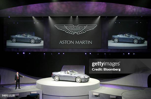 Ulrich Bez, CEO of Aston Martin Lagonda, introduces the Aston Martin DB9 Volante during the North American International Auto Show at Cobo Arena in...