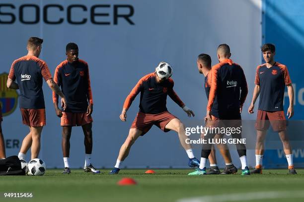 Barcelona's Croatian midfielder Ivan Rakitic plays a ball during a training session at the Joan Gamper Sports Center in Sant Joan Despi, near...