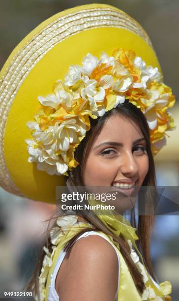 Dream Flowers by Isabel Borges - one of the Festival hostesses wears a hand made floral dress and hat in the center of Funchal, the capital of...