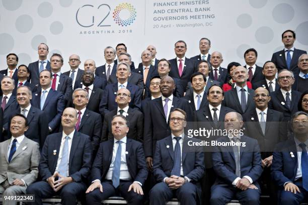 Group of 20 finance ministers and central bank governors including Taro Aso, Japan's finance minister, front row from left, Federico Sturzenegger,...
