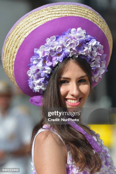 Dream Flowers by Isabel Borges - one of the Festival hostesses wears a hand made floral dress and hat in the center of Funchal, the capital of...