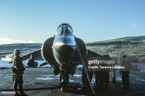 Squadron Sea Harrier aircraft landing on HMS Fearless L10 during the Falklands War 1982. It was unable to land at the damaged Sheathbill air strip,...