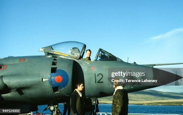 Squadron Sea Harrier aircraft landing on HMS Fearless L10 during the Falklands War 1982. It was unable to land at the damaged Sheathbill air strip,...