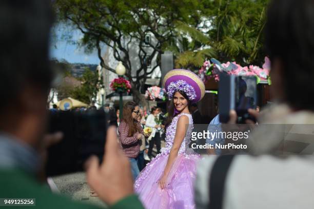 Dream Flowers by Isabel Borges - one of the Festival hostesses wears a hand made floral dress and hat in the center of Funchal, the capital of...