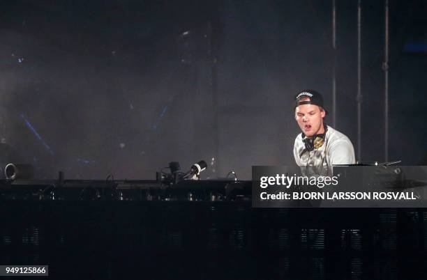 Picture taken on May 30, 2015 shows Swedish musician, DJ, remixer and record producer Avicii performing at the Summerburst music festival at Ullevi...