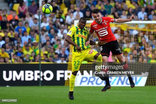 Nantes' Burkinabe forward Prejuce Nakoulma vies with Rennes' French defender Jérémy Gellin during the French L1 football match Nantes against Rennes...