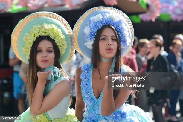 Dream Flowers by Isabel Borges - two of the Festival hostesses wear a hand made floral dresses and hats in the center of Funchal, the capital of...