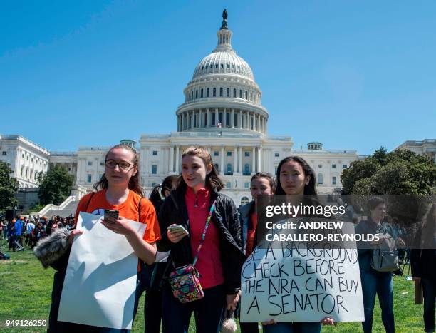 Students walk down the West Lawn of the US Capitol after rallying with several hundred fellow students to call for stricter gun laws in Washington,...