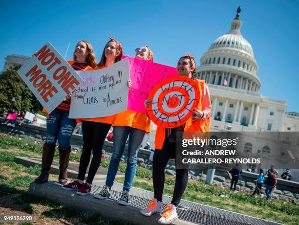 Students pose for a photo on the West Lawn of the US Capitol after rallying with several hundred fellow students to call for stricter gun laws in...