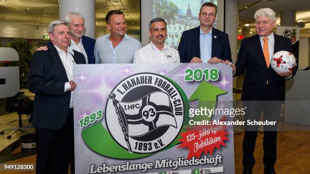 President Reinhard Grindel and Rudi Voeller overhand the lifetime membership of Hanauer FC to Frank Trimhold during the 125th anniversary of 1....