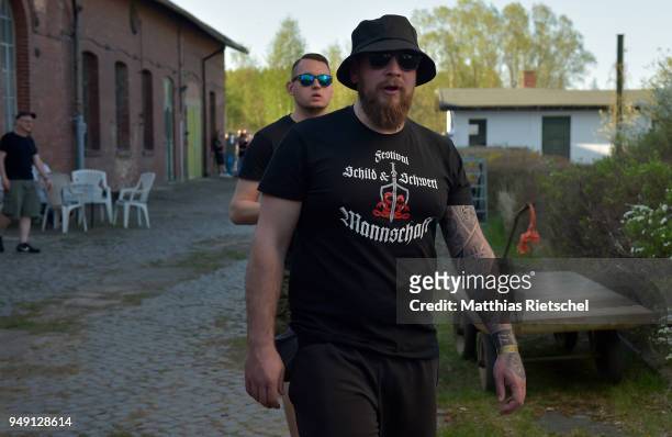 Participant of "Shield and Sword" wears a festival shirt, on April 20, 2018 in Ostritz, Germany. Police are expecting over 1,000 neo-Nazis from...