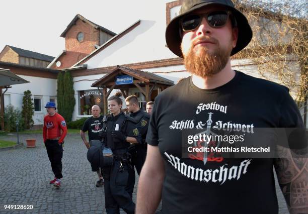 Participant of "Shield and Sword" wears a festival shirt, on April 20, 2018 in Ostritz, Germany. The hotel is situated close to the Poland-Germany...