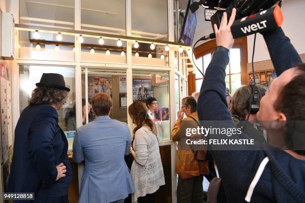 Picture taken on April 20, 2018 shows people getting tickets at the theatre where the play "Mein Kampf" written by George Tabori is been shown in...
