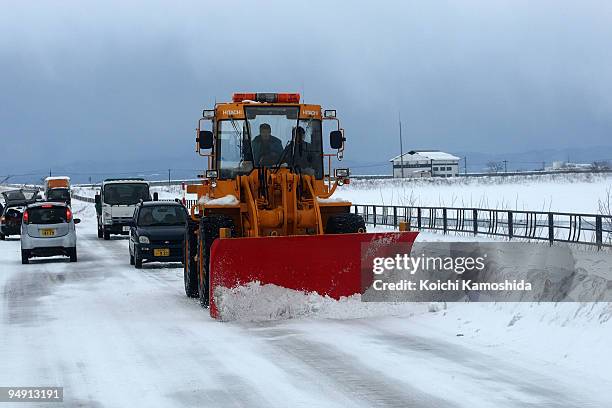 Bulldozer removes snow from a road at Tsuruoka city on December 19, 2009 in Yamagata Prefecture, Japan.