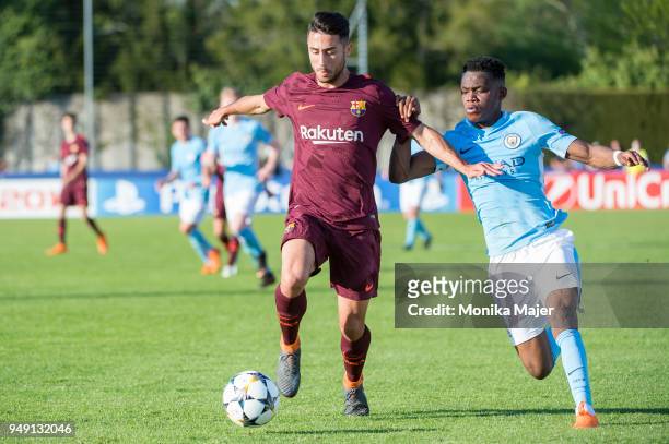 Guile Jaime of FC Barcelona vies with Tom Dele-Bashiru of Manchester City during the semi-final football match between Manchester City and FC...
