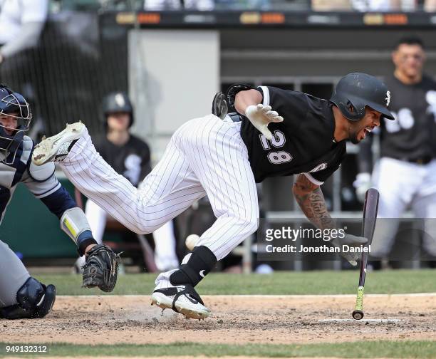 Leury Garcia of the Chicago White Sox hits the ground after being hit on the shin by a pitch in the 7th inning against the Tampa Bay Rays at...