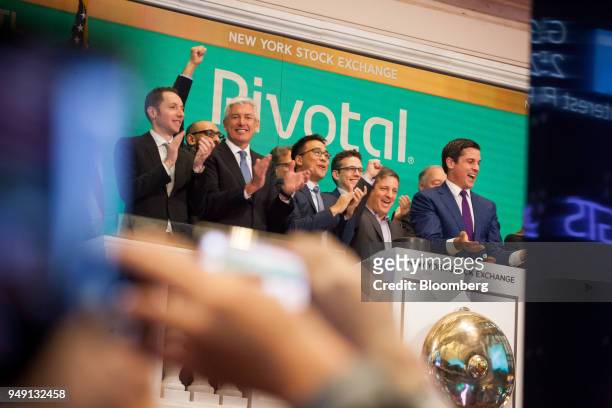 Rob Mee, chief executive officer of Pivotal Software Inc., center right, rings the opening bell during the company's initial public offering on the...