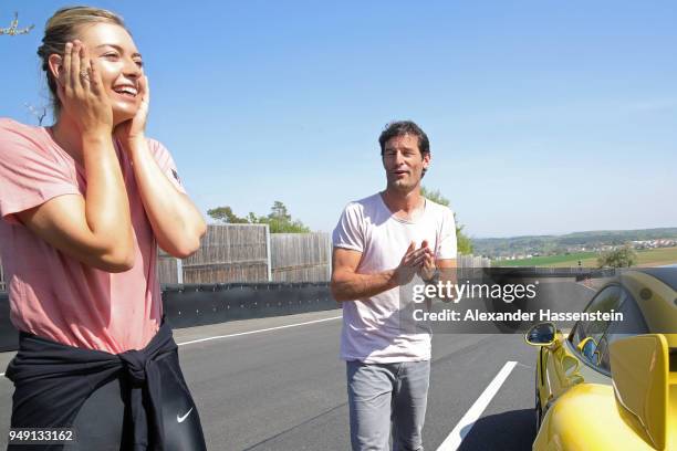 Porsche Brand Ambassadors Maria Sharapova and Mark Webber interact during a break of driving with the high performance sports car Porsche 911 RT2 RS...