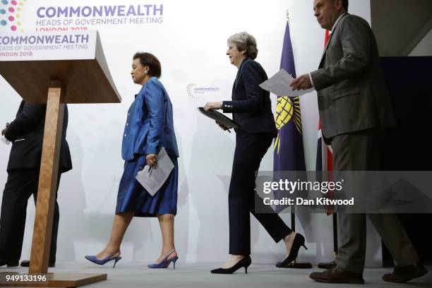 British Prime Minister Theresa May arrives with other leaders to speak during the final press conference of CHOGM 2018 at Marlborough House on April...