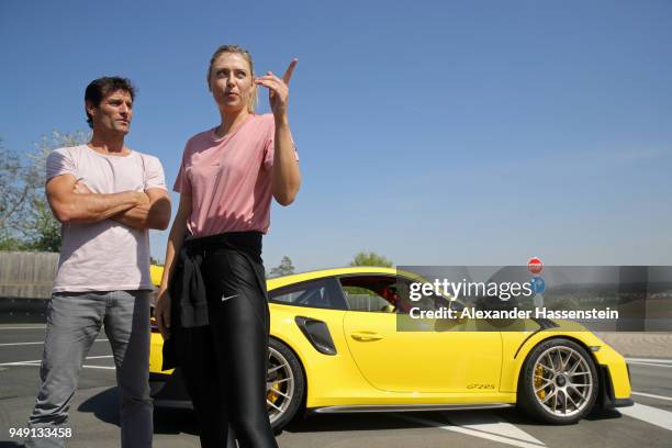 Porsche Brand Ambassadors Maria Sharapova and Mark Webber interact during a break of driving with the high performance sports car Porsche 911 RT2 RS...